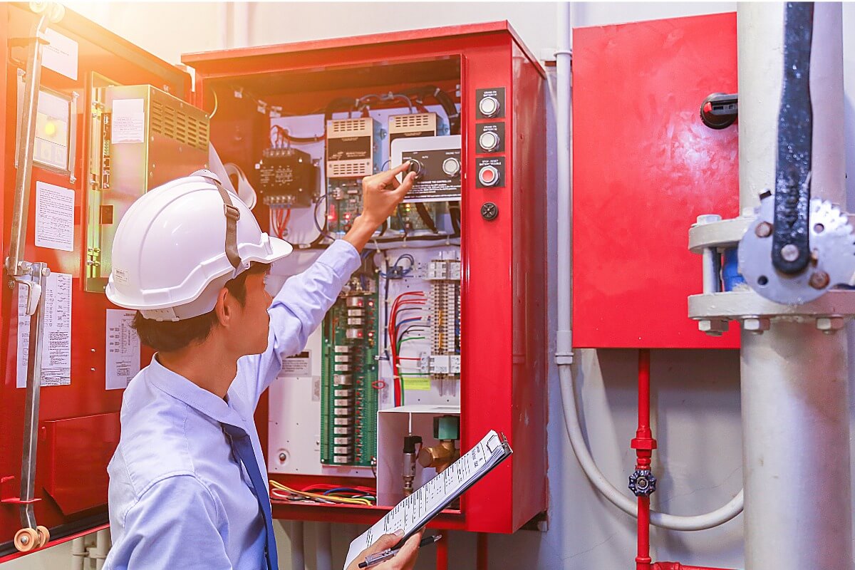 Fire alarm system being inspected.